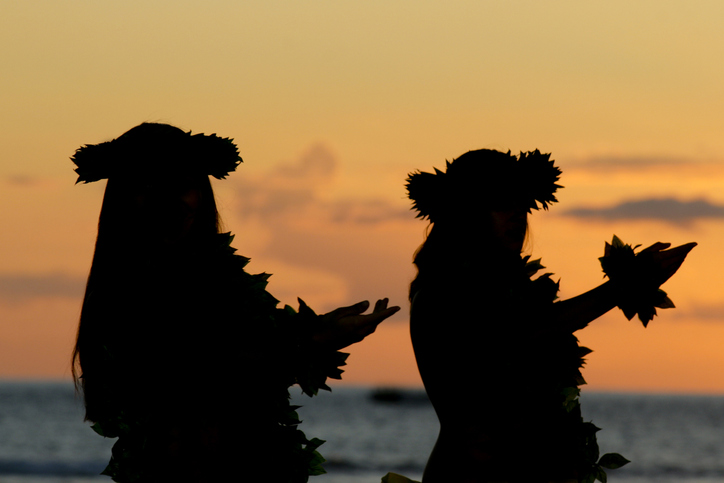 Girls dance the Hula during sunset