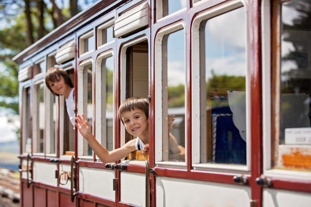 two children on a kid-friendly train ride 