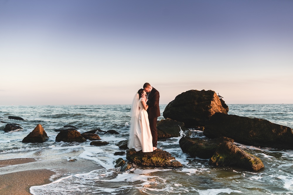 married couple on beach in Hawaii