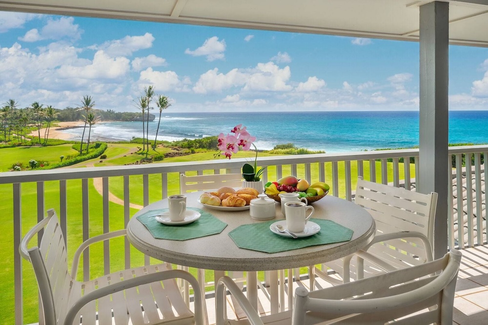 Lanai overlooking the beach at a Poipu Beach vacation rental