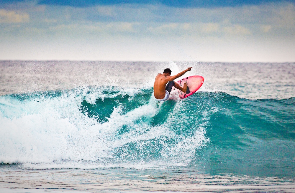 man surfing a wave on Kauai