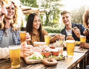 a group of friends tastes beers at a poipu brewery