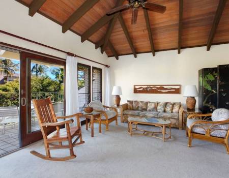 sunroom with ceiling fan in poipu