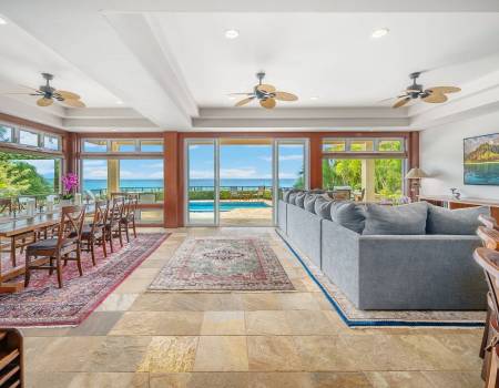 a large livining and dining room area with breathtaking ocean view