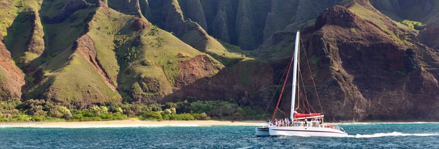 catamaran in Kauai with mountains in background