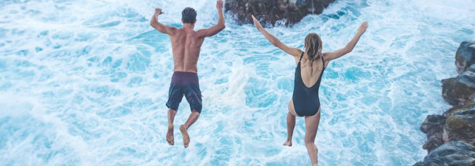 couple cliff diving