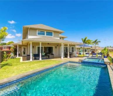 a large house with a private pool in poipu