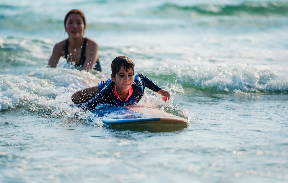 Little kid learning to surf