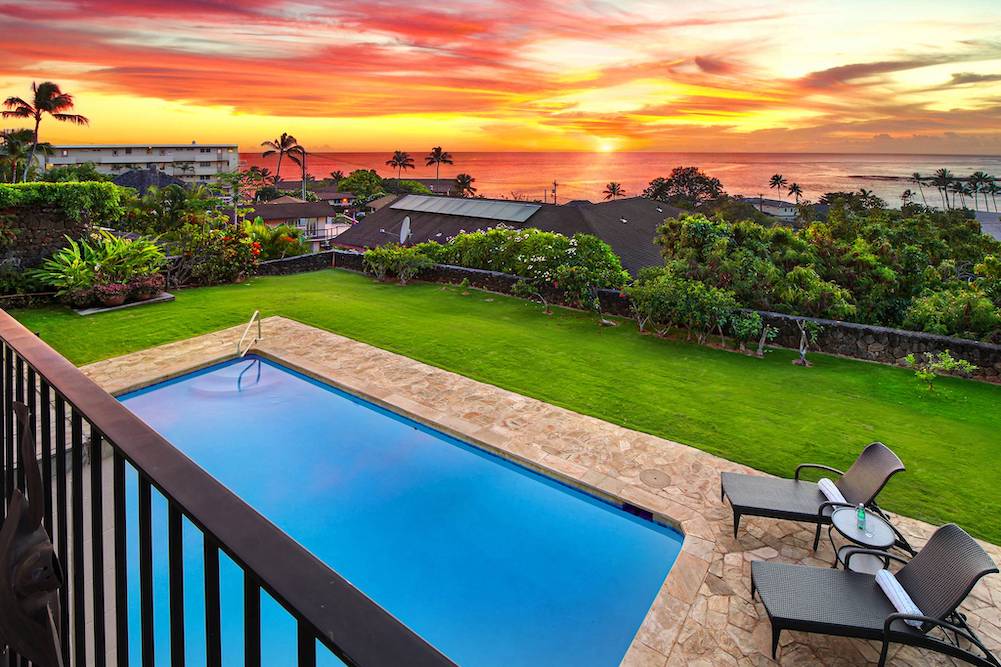 view of private pool and hawaiian sunset